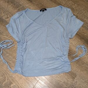 A blue cropped shirt